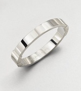 A classic design perfect on it's own or paired with more detailed pieces. Silvertone steelHinged clasp closureDiameter, about 2½Imported 