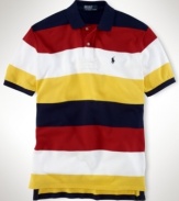 Rendered in breathable cotton mesh, a classic-fitting polo shirt is accented with bold stripes for a handsome, athletic look.