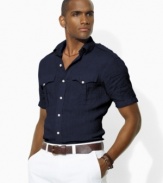 Rendered in lightweight, sun-faded linen for a vintage look, a modern short-sleeved shirt is finished with military-inspired details for a cool, rugged vibe.