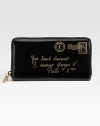 Smooth patent leather embossed with logo address line, features a zip around closure.Zip around closure Center zip compartment Three center compartments Twelve credit card slots Nylon lining 7½W X 4H X 1D Made in Italy
