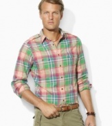 A bold, heritage plaid lends rugged quality to a trim-fitting military shirt in lightweight cotton twill.