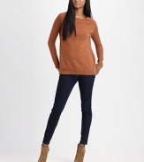 Sassy wool crewneck with semi-sheer, open-stitch sleeves and a split hem. Ribbed crewneckLong open-knit sleevesRibbed cuffsRibbed split hemWoolDry cleanImported