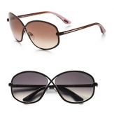 Oversized criss-cross frame holds a floating lens, with a logo medallion on the arms. Available in brown with brown gradient lens or gunmetal with smoke gradient lens. 100% UV protection Metal Made in Italy
