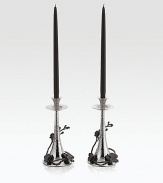 From the Black Orchid Collection. Delicately detailed in cast metal, graceful orchid stems wrap around the tapered hammered base of these striking candlesticks, adding beauty to your table or mantel.Black and polished nickel-plated metal alloyHand-finishedHolds standard tapers (not included) 11HHand washImported