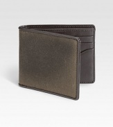 A classic water resistant fabric, waxwear acquires a beautiful patina with age and use. French-edged with leather, this bill holder mixes utilitarian and luxe materials to create a uniquely masculine wallet.One billfold compartmentSix card slotsWaxed cotton/leather4W x 4HImported