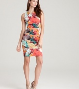 Beautiful brushstroked blooms thrive on this fitted Calvin Klein sheath, designed in a modern paneled construction.