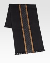 Winter scarf with interlocking GG pattern, stripes and fringe. 13¾W X 71L Silk/wool; dry clean Made in Italy 