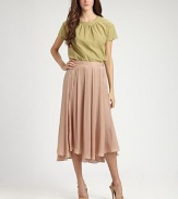 Soft variegated pleats lend shape to this airy, feminine tea-length silhouette.Self waistbandPleatedAsymmetrical hemConcealed side zipAbout 31½ from natural waistPolyesterDry cleanMade in Italy of imported fabricModel shown is 5'11 (180cm) wearing US size 4. 