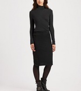 Rich wool knit hugs the body in a sleek pencil silhouette.High banded waistSide panelsCenter back zipperVented hemAbout 22 longWoolDry cleanImported