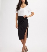 Slinky jersey knit wraps elegantly at the hips for a sleek, sophisticated look.Elastic waistband Pull-on style Side slit About 33 long 94% rayon/6% spandex Dry clean Made in USA
