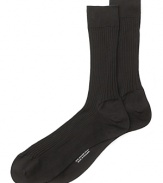 Turnbull & Asser maintains its focus on quality craftsmanship and luxury even on everyday essentials like fine dress socks in soft, breathable cotton.