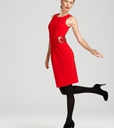 Starburst pleating and a gleaming metal ring lend modern flair to this timeless Calvin Klein shift dress.