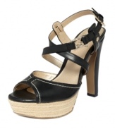 The Cavio sandals from G by GUESS combine dainty straps with daring buckles and a straw-covered platform for a look that is as unique as you.