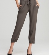 A slim, fluid silhouette and updated cargo details lend a sophisticated air to these Eileen Fisher silk cropped pants.