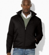A classic-fitting lightweight windbreaker in high-performance water-resistant microfiber is equipped with a concealed zip-in hood for versatile protection.