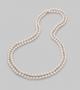 A strand of lustrous white organic pearls goes on and on, down past your waist, to wear long, wrapped or knotted. 8mm white round man-made pearls Length, about 60 Made in Spain