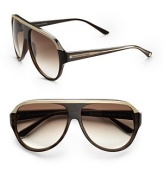 Oversized acetate aviators with stud detail embellishments and Balenciaga logo on temple. Available in horn walnut crystal with brown gradient lens.100% UV protection Made in Italy 