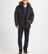 Exceptionally stylish and warm, this winter favorite is enriched with a removable hood trimmed with coyote fur.Zip frontHalf snap button placketRemovable hoodZippered chest, waist pocketsAbout 31½ from shoulder to hemDown fillNylonDry cleanImportedFur origin: China