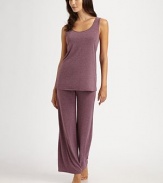 An comfortable style with a wide scoopneck design, perfect for layering or lounging. ScoopneckSleevelessPull-on styleAbout 26 from shoulder to hem67% polyester/33% rayonMachine washImported 