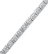 A shimmering statement. This bold sterling silver bracelet sparkles with round and baguette-cut diamonds (2 ct. t.w.) and is sure to leave a lasting impression at any formal affair. Approximate length: 7-1/4 inches.