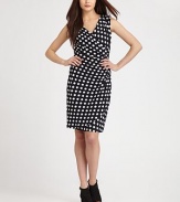 Bold polka dots decorate this flattering, form-fitting design.Surplice necklineSleevelessRuched sideTulip hemlineBack ruchingConcealed back zipFully linedAbout 22 from natural waist95% rayon/5% spandexDry cleanImportedModel shown is 5'10 (177cm) wearing US size 4. 
