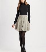 Chic pointelle accents give this classic knit turtleneck an extra splash of style.TurtleneckPointelle details at shouldersLong sleeves with cinched cuffs65% viscose/28% nylon/7% elastaneDry cleanImportedModel is 5'11½ (181 cm) wearing US size Small.