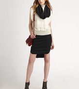 Featherweight angora blend finished with a chunky-knit on the front.Turtleneck Sleeveless Fine-rib trim Loose fit About 22 from shoulder to hem 80% angora/20% nylon; combo: merino wool Dry clean Imported