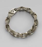 A contemporary spin on a sartorial classic, carved in links of sterling silver with thorn detail. Sterling silver Length, about 9 Diameter, about 3 Lobster clasp closure Imported
