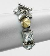 A modern mix of faceted rhinestones and conical, metal studs set in a linked design. Glass stonesOxidized zinc and brassLength, about 7.5Toggle closureImported 