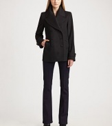 Double-breasted classic is impeccably tailored in exceptionally warm wool/cashmere.Wide notched lapel Button front Side buttoned pockets Buttoned tabs on sleeves Back buttoned half-belt Back vent at hem About 34 from shoulder to hem 80% virgin wool/20% cashmere Dry clean Imported