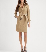 The label's iconic trench, dressed up with a bold, striped raffia-knit collar.Foldover raffia collarButton gunflapsEpaulettesButton frontLong sleeves with button-strap cuffsSelf beltButton-down rainflapAbout 37 from shoulder to hemCottonDry cleanMade in ItalyModel shown is 5'9½ (176cm) wearing US size 4. 
