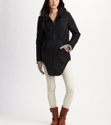 Soft quilting adds a cozy touch to this ultra-modern design finished with an exaggerated shirttail hem.Hood Foldover collar Zip-front Zip-cuffs Front slash pockets Exaggerated shirttail hem About 37 from shoulder to hem Wool Dry clean Made in USA of imported fabric