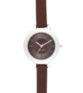 Walk the line between casual and dressy with this Nine West watch. Crafted of brown leather strap and round silver tone mixed metal case. Brown textured dial features silver tone hour and minute hands, sweeping second hand, applied numerals at twelve and six o'clock, stick indices and logo at six o'clock. Quartz movement. Limited lifetime warranty.