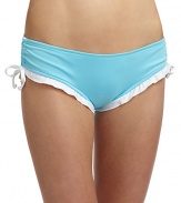 THE LOOKElastic waist and leg openingsShirred sides with drawstringsContrast ruffles trim the leg openingsTHE MATERIAL80% nylon/20% spandexCARE & ORIGINHand washMade in USA of imported fabricPlease note: Bikini top sold separately. 