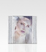 Thousands of shimmering chatons glitter in the columns of this festive picture frame with silvertone metal details. Accommodates a 5 X 7 photograph Overall: 7 X 7½ Made in Austria 