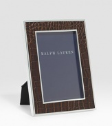 An elegant, silverplated brass frame, wrapped in alligator-embossed leather. Arrives in a gift box Accommodates a 4 X 6 photograph Overall: 6 X 8 Imported 