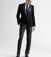 An elegantly-tailored formal look is designed with slim legs and tonal stain trim at the waist and down the leg. Zip fly Side slash pockets Back welt pockets Rayon Dry clean Made in Italy 