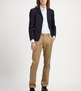 An old favorite updated with a contemporary feel flare, cut in slim-fitting, crisp cotton twill.ButtonfrontChest, waist patch pocketsRear ventAbout 28 from shoulder to hemCottonMachine washImported