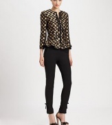 Featuring a peplum waist, one of the hottest trends of the season, this leopard-print jacquard jacket with metallic accents, is beyond eye-catching.Round collarLong sleevesSelf-tie detail at necklineFront zipperPrincess seamsPatch pocketsPeplum waistAbout 21 from shoulder to hem56% polyester/30% acetate/11% wool/3% polyamideDry cleanMade in Italy of imported fabric