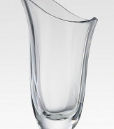 Smooth, fluid lines wrap around this stunning vase of fine crystal. 12 highHand washImported