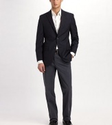 EXCLUSIVELY OURS. An essential look destined for every man's wardrobe, tailored with an easy-wearing silhouette that's fit for blazers and sportshirts alike. Flat front Side slash, back welt pockets Unfinished hems 52% cotton/48% polyester Machine wash Imported 