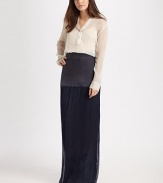 This classic silhouette made of featherweight Italian silk is utterly feminine. Round neckHalfway button frontLong sleeves with cuffsSemi-sheer eyelet detailsSide split hemSilkDry cleanImportedModel is 5'10 (177 cm) wearing a US size Small.