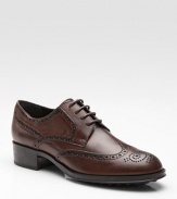 Oxford-inspired, leather style has a lace-up front and intricate cut-out details. Leather upper Leather lining Rubber sole Padded insole Made in Italy