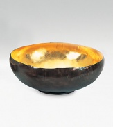 From the Sona Collection. A modern take on an ancient offering bowl, this glowing, gold-lined design has a simple, modern shape but the fascinating feel of an artifact unearthed long ago.Solid bronze with an oxidized finishGold interiorHand-finished12 diameter X 4.75HHand washImported