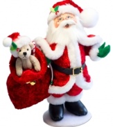 Santa at his best. The jolliest man on Christmas dons a red velour suit and bag of toys and treats in this quintessential holiday figurine. With the soft features and unmistakable style of Annalee dolls.