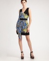 A graphic floral print in a two-tone color combination with pleated and draped front panel.V-neck Wrap front Pleated, draped front panel Banded waist and hem Gathered rear yoke About 20 from natural waist Silk; dry clean Imported Additional Information Women's Premier Designer & Contemporary Size Guide 