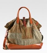 Evoking the aesthetic of vintage fishing bags, a timeless silhouette receives modern polish from a patchwork tweed construction with leather accents.Roller-buckle closureDouble top handlesAdjustable shoulder strapInterior zip pocketAntiqued brass grommet detailingReinforced leather bottomCotton twill liningTweed17W x 16H x 6DImported