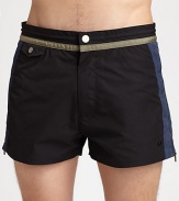 A sleek swim style featuring colorblock details. Snap button closureFront snap and slash pocketBack pocketsInseam, about 3PolyesterMachine washImported