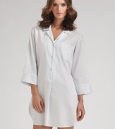A loose-fitting, relaxed style with a traditional notch collar and full-length sleeves. Pullover style Partial button-front placket Front patch pocket About 36 from shoulder to hem Cotton; machine wash Imported