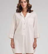 A loose-fitting, relaxed style with a traditional notch collar and full-length sleeves. Pullover style Partial button-front placket Front patch pocket About 36 from shoulder to hem Cotton; machine wash Imported